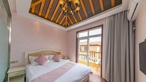 A bedroom with a wooden ceiling, a bed with white bedding, a nightstand, and a view to the outside. - Zhujiajian Coast Chaosu Art Inn (Zhoushan)