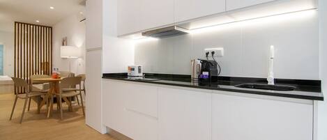 Fridge, microwave, stovetop, coffee/tea maker