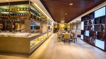 A modern interior with a bar area, seating, and display shelves.