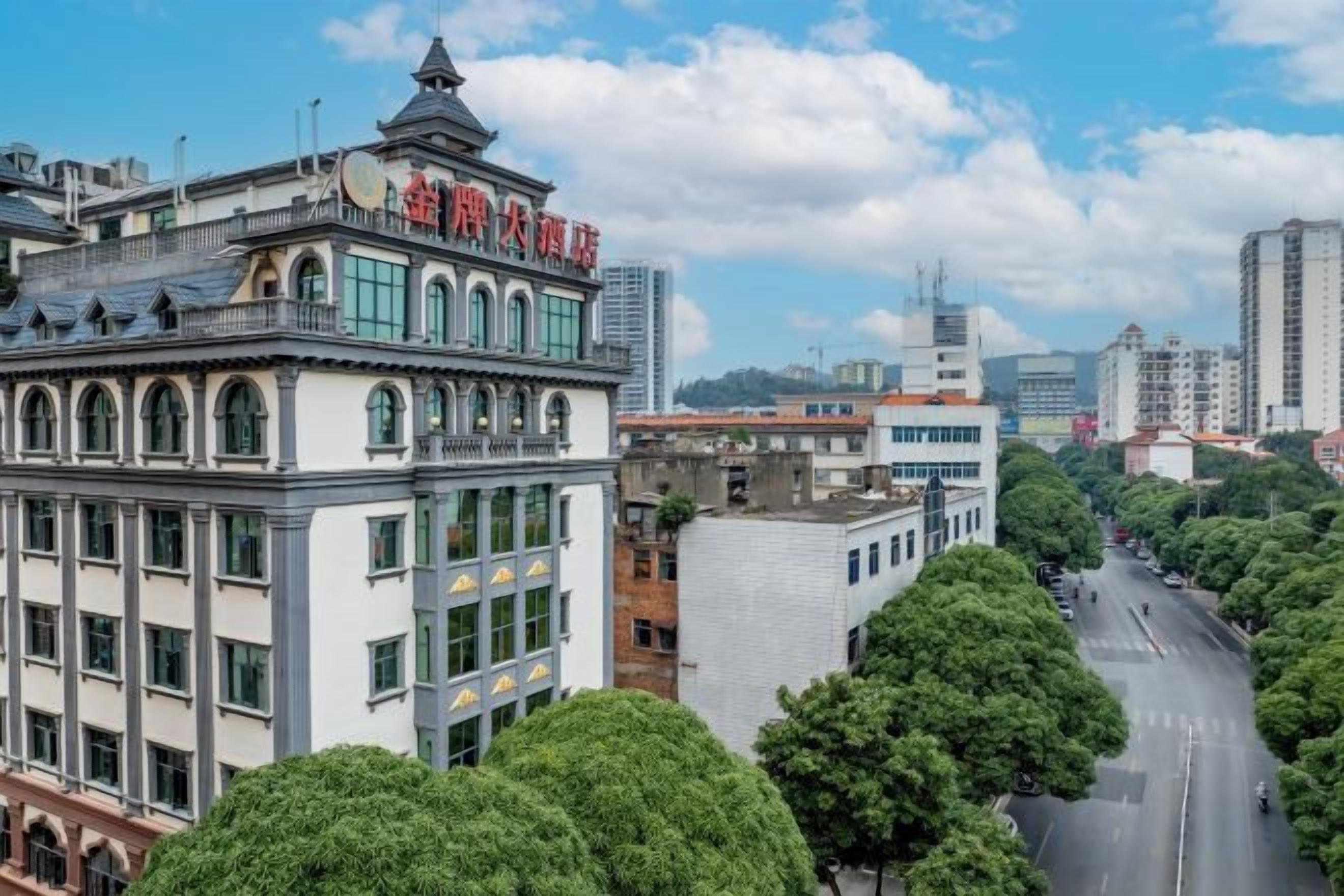 A multi-story building with a classic architectural style, featuring a prominent entrance and large windows.