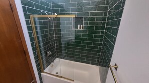 Shower, jetted tub, towels, soap
