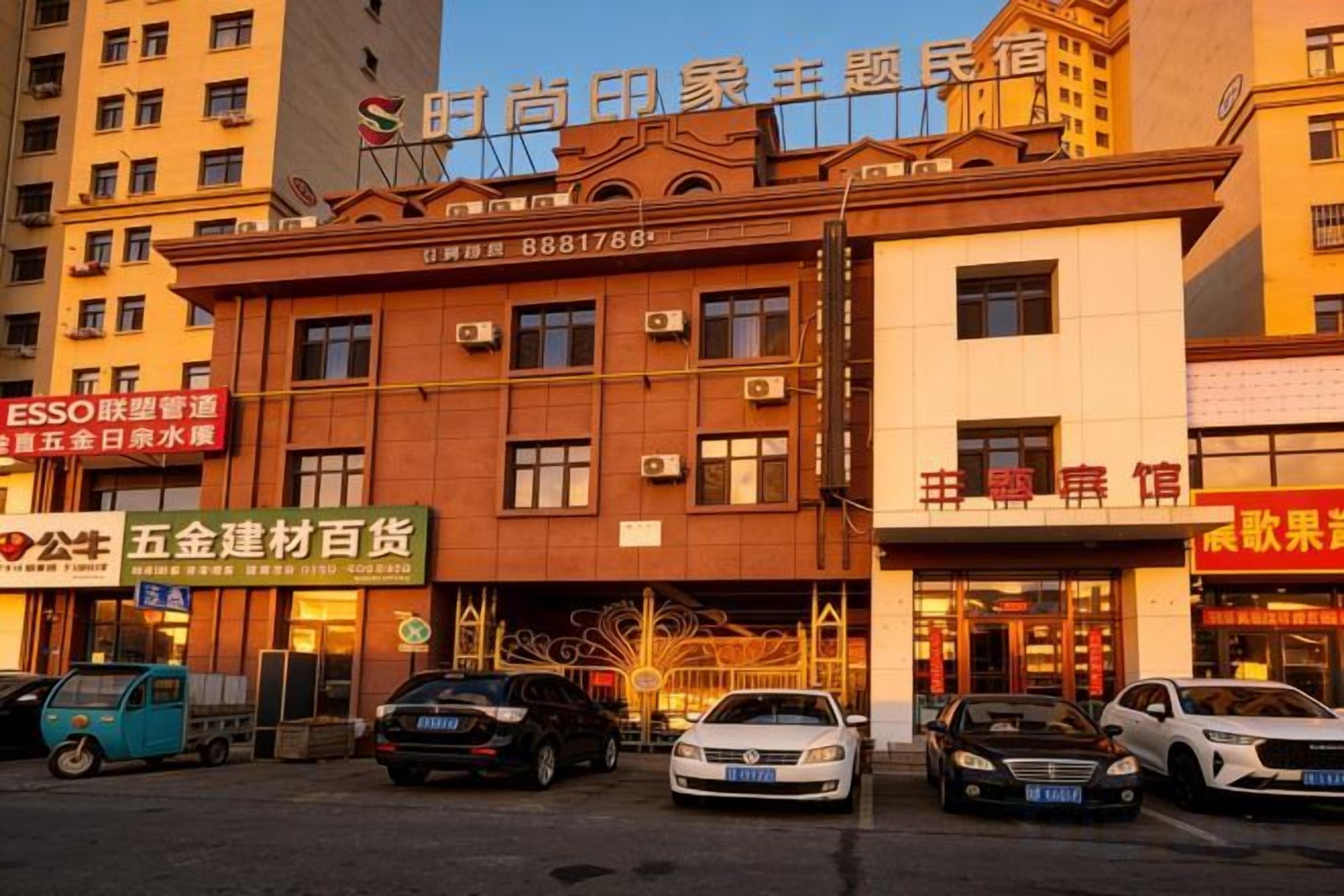 A multi-story building with a prominent sign at the top.