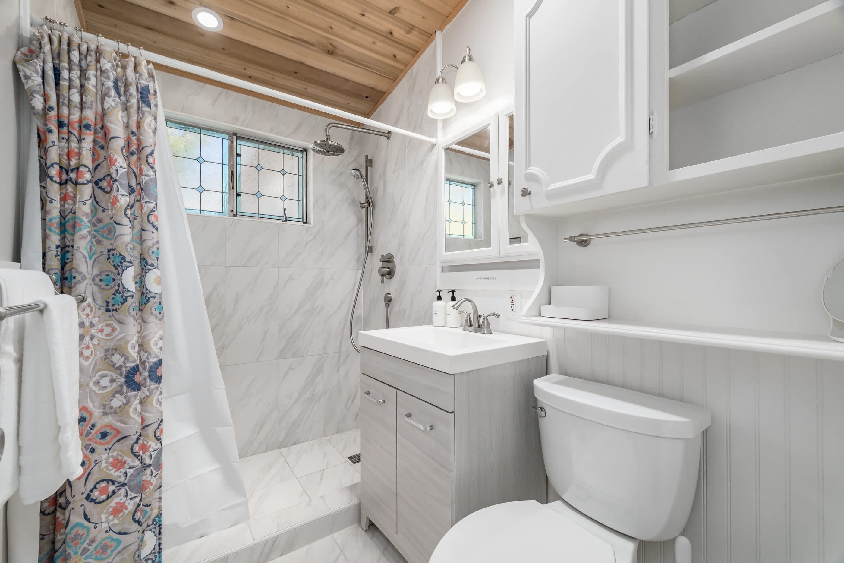 Shower, hair dryer, towels, shampoo