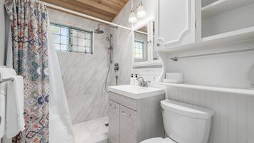 Shower, hair dryer, towels, shampoo