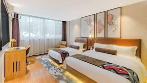 A hotel room with two beds, a desk, and a large window. - Shexian Huizhou Gucheng store JAMES JOYCE COFFETEL (She County)