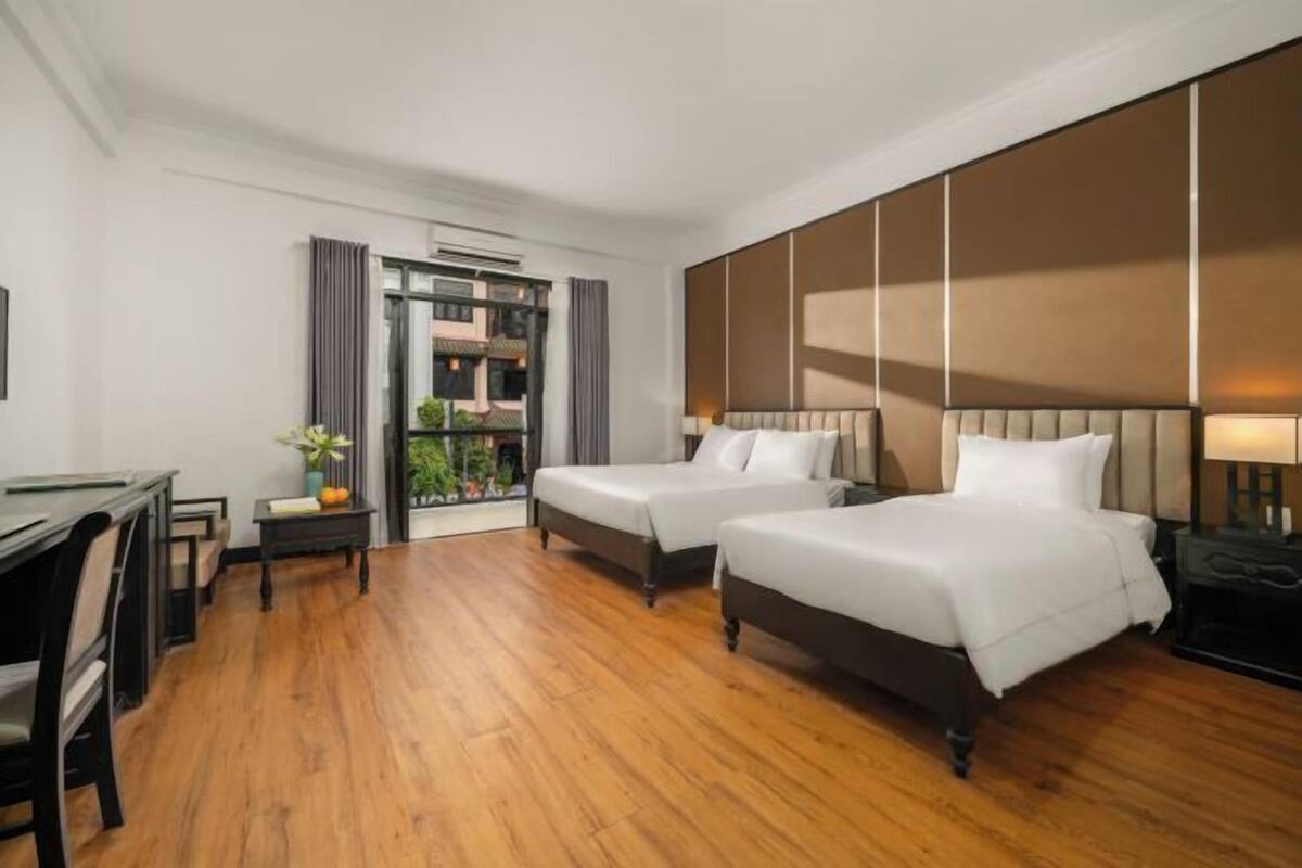 Premium bedding, pillow-top beds, desk, blackout curtains