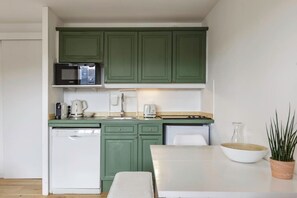 Microwave, stovetop, dishwasher, coffee/tea maker