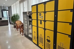 Welcome to our lobby, featuring a reception desk, comfortable seating area, and convenient room assignment lockers.