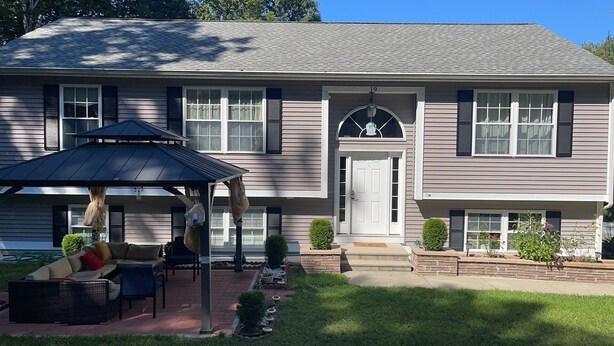 A two-story house with a covered patio area, a front door, and a mailbox. - Cozy, comfy,quiet &close to casinos (Montville)
