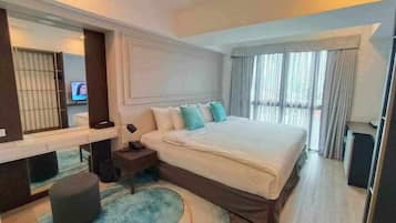 Deluxe Room, City View | In-room safe, desk, laptop workspace, soundproofing