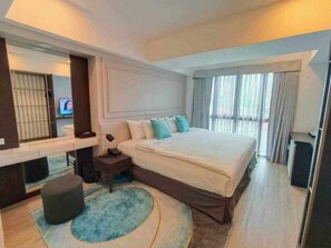 Deluxe Room, City View | In-room safe, desk, laptop workspace, soundproofing