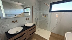 Shower, hair dryer, towels, soap