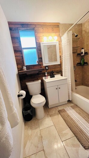 Hair dryer, towels, soap, shampoo