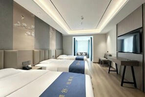 A hotel room with three beds, a desk, a TV, and a large window. - Huashu Yi Hotel (Pinghu Branch) (Pinghu)