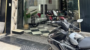 A storefront with a black and gold sign reading "AMAN SPA & WELLNESS". - New HoLo Le Thanh Ton SaiGon (Ho Chi Minh City)