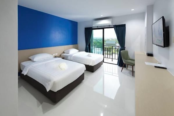 A hotel room with two beds, a desk, a chair, a TV, and a balcony with a view. - B Hotel Khon Kaen (Khon Kaen)