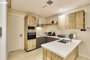 Apartment | Private kitchen | Fridge, microwave, oven, stovetop - bnbmehomes-3BR nr Wonder Garden-B12 (Riyadh)