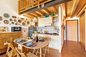 Standard Apartment, Multiple Bedrooms (Grotten Loft with lake view & pool) | Private kitchen | Fridge, microwave, stovetop, coffee/tea maker - Grotten Loft with lake view and pool (Toscolano Maderno)