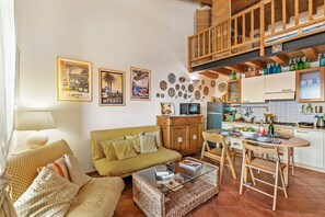 Standard Apartment, Multiple Bedrooms (Grotten Loft with lake view & pool) | Living area | 21-inch Smart TV with cable channels - Grotten Loft with lake view and pool (Toscolano Maderno)