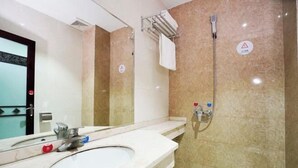 A bathroom with a sink, mirror, towel rack, and shower. - Zixing Dada Business Hotel (Zixing)