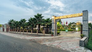 A gated entrance to a hotel with a sign reading 'GALAXY GARDEN RESORT.' - Galaxy Garden Resort (Bharatpur)