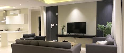 Design Apartment, 3 Bedrooms | Living area | Flat-screen TV