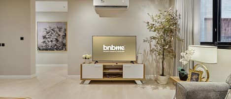 Apartment | Living area | 42-inch LCD TV with cable channels, Netflix, streaming services