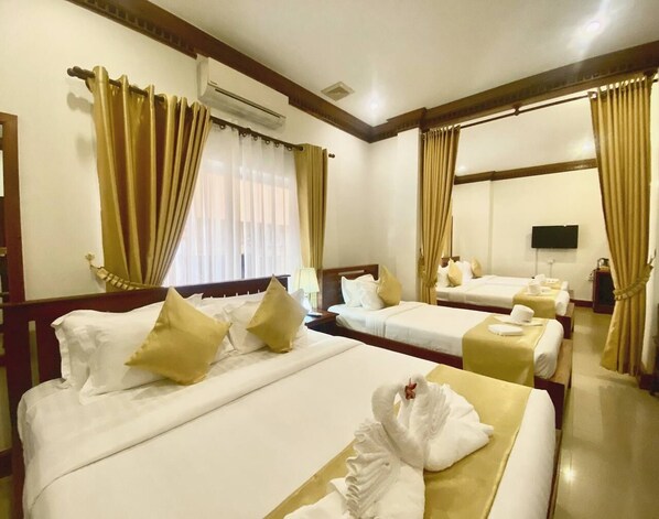 Deluxe Quadruple Room, Multiple Beds, City View | 1 bedroom, blackout curtains, iron/ironing board, free WiFi