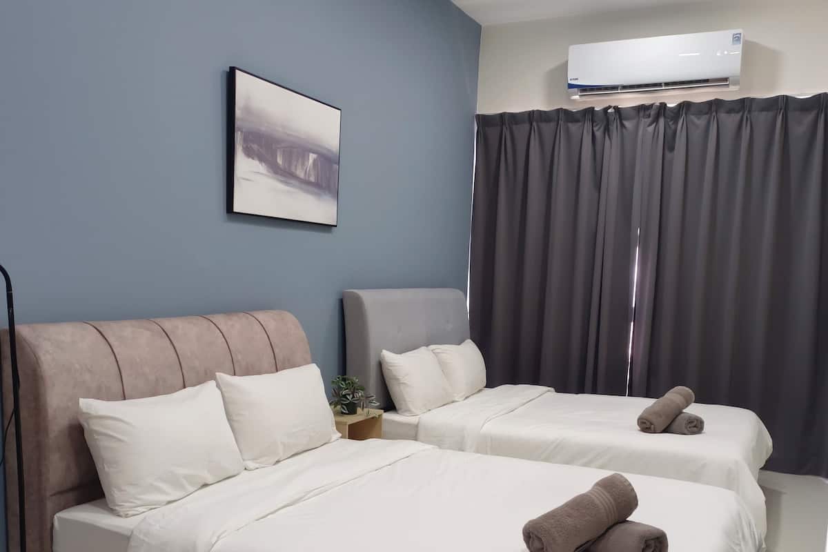 A hotel room with two beds, a large window with curtains, an air conditioning unit, and a painting on the wall.