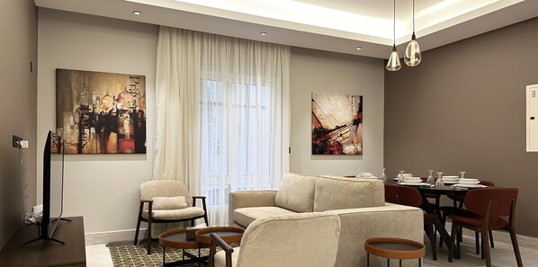 Design Apartment, 3 Bedrooms | Living area | Flat-screen TV