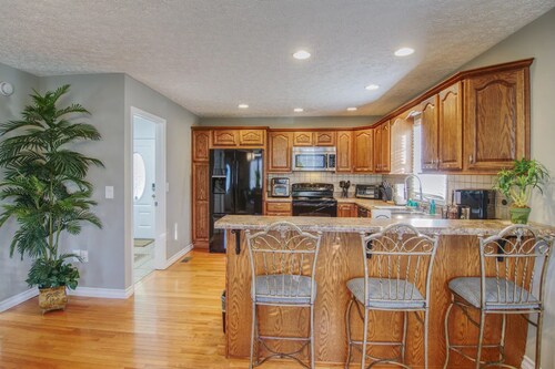 Experience the serenity of a peaceful neighborhood and the excitement of the city .