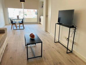 TV - Modern studio apartment with balcony in Almagro (Buenos Aires)