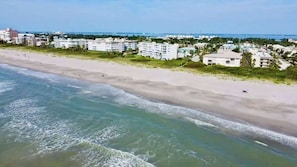 A coastal hotel with beachfront access, multiple stories, and a view of the ocean. - Fillmore Unit #7 | 2BR/1BA (Cape Canaveral)