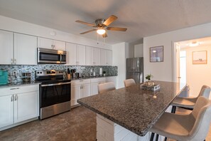 Fridge, microwave, oven, stovetop - Modern condo with community pool (Cape Canaveral)