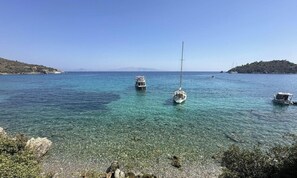 A clear coastal waterway with boats, rocky shoreline, and distant hills. - Villa Carian Trail evdatca, Kargı Bay Datca, close to the beach (Datça)