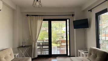 Vila família, 2 quartos, cozinha, no jardim | Sala de estar