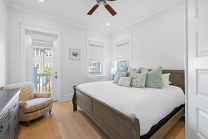 A bedroom with a bed, a chair, a dresser, and a ceiling fan. - Prominence Next to The Big Chill! 6-Seater LSV/Golf Cart, 4 Bikes, GULF VIEWS! (Alys Beach)