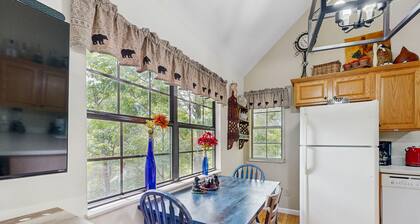 Charming cabin w/ hot tub, firepit, mountain views, & free attraction tickets