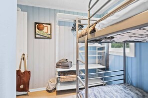 A bunk bed room with a window, a framed picture, a bag, and a basket. - Blue Sky Cottage: Sunset Shores Kangaroo Lake (Baileys Harbor)