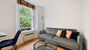Executive Apartment | Living area | 43-inch Smart TV with digital channels, Netflix, streaming services