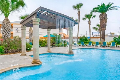 Beach-view condo steps from Babe’s Beach with pool, hot tub, balcony, & W/D