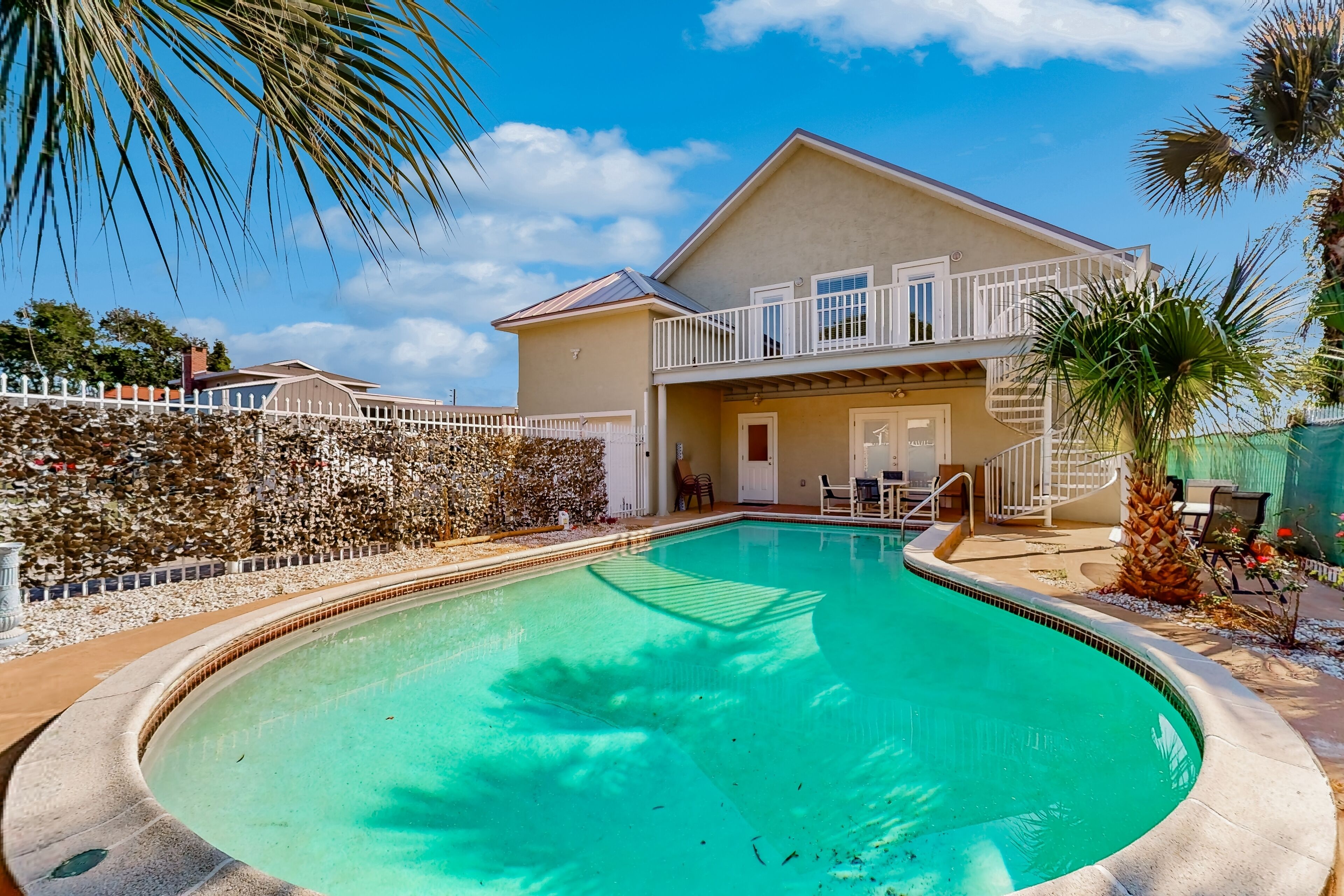 Riverfront home near beach with private pool & loft