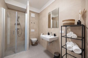 Double Room | Bathroom | Shower, hair dryer, heated floors, towels