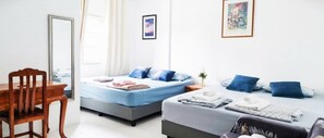 A modern bedroom with a bed, a desk, and a chair. - Ban Sawasdee, 3 Bedrooms Townhouse, Large home, near Don Mueang Airport (Lamlukka)
