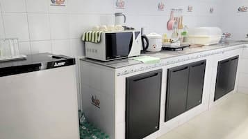 Fridge, microwave, stovetop, cookware/dishes/utensils