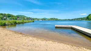 A river with a sandy beach and a concrete dock. - Biltmore discount tickets|close to Cataloochee ski (Waynesville)