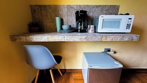 A compact kitchen with a microwave, coffee maker, and a small refrigerator. - Room for 3 people, 3 blocks from 5th avenue and public beach 🏖️🏝️ (Playa del Carmen)