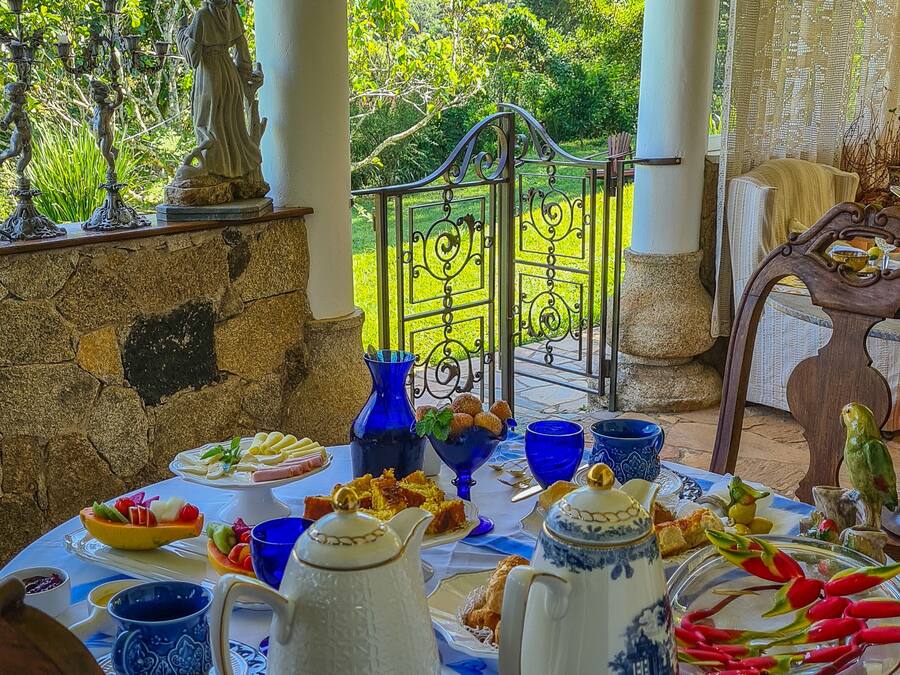 A table set for breakfast with a scenic mountain view in the background.