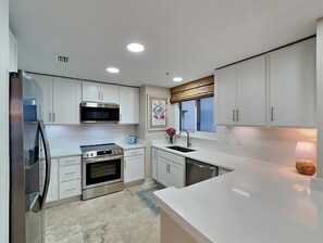 Condo, Multiple Beds, Balcony, Ocean View (South Harbour #2F - No Pets Allowed) | Private kitchen | Stovetop, coffee/tea maker