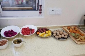 A kitchen counter with various bowls of food items. - Sanya Haitang Bay Rujia Hotel (Sanya)
